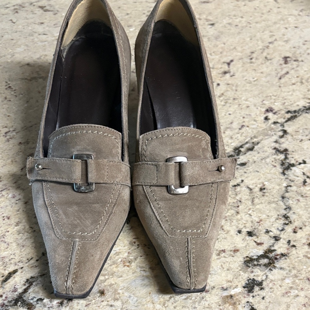 These shoes were made in Italy and are 2 1/2 heels.